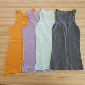 Lot of 4 razor back basic tank tops size M and L